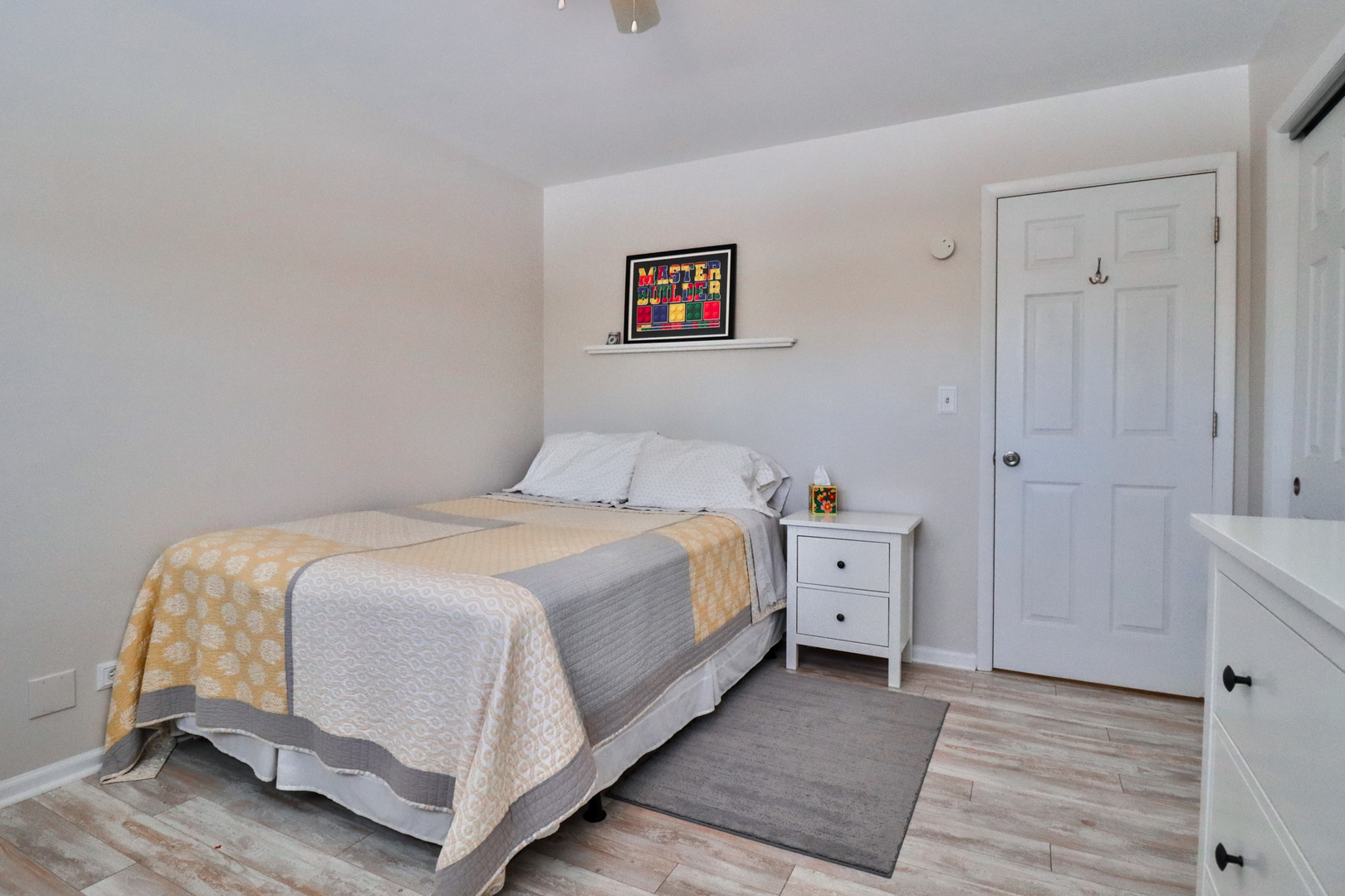 1920 North Washington Street Wheaton, IL 60187 - Photo 18 of 76 a spacious bedroom with a bed and a cabinets
