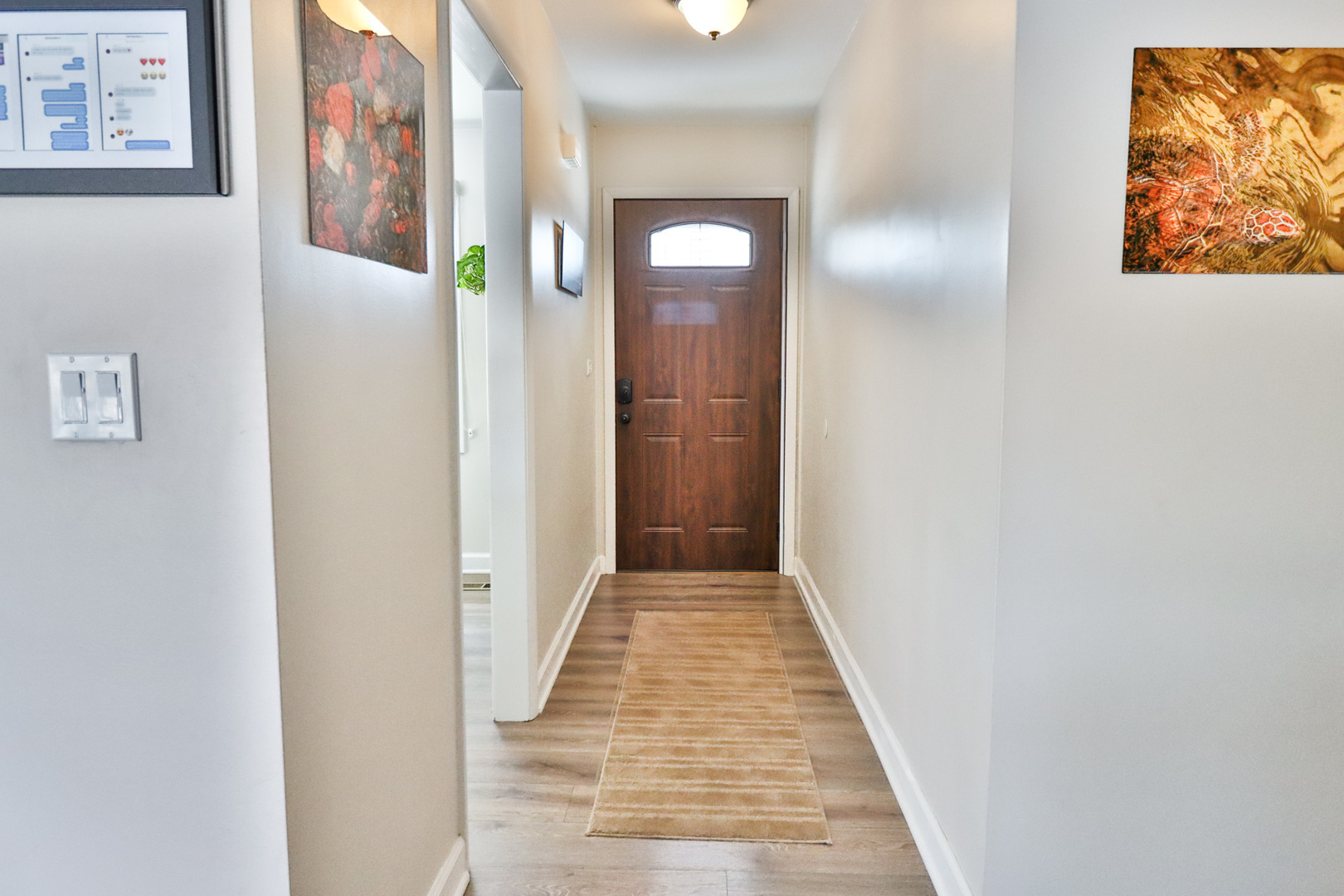1920 North Washington Street Wheaton, IL 60187 - Photo 3 of 76 a view of a hallway with wooden floor