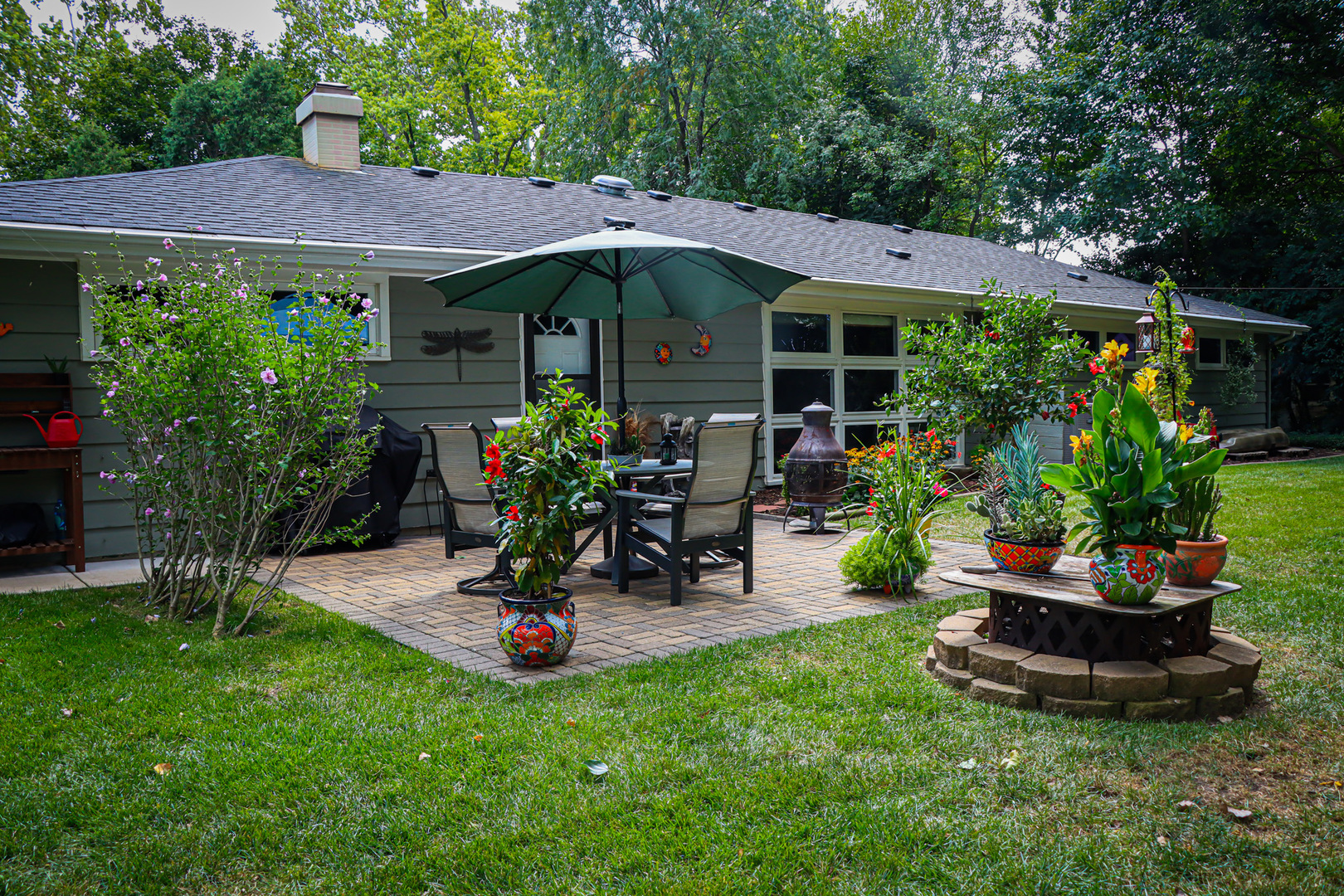 1920 North Washington Street Wheaton, IL 60187 - Photo 45 of 76 a view of a chair and table in backyard of the house