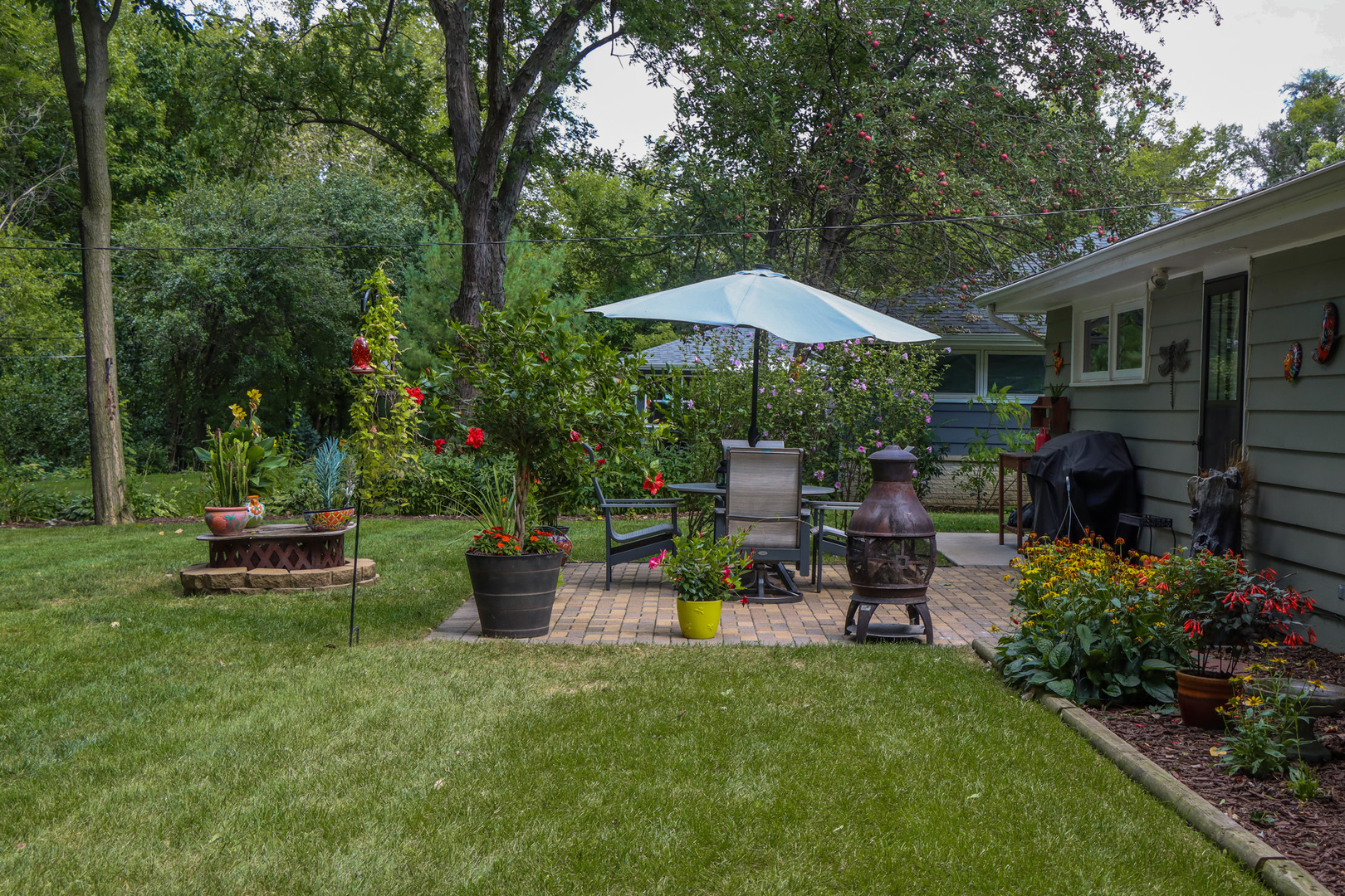 1920 North Washington Street Wheaton, IL 60187 - Photo 47 of 76 a view of a patio with chairs and plants
