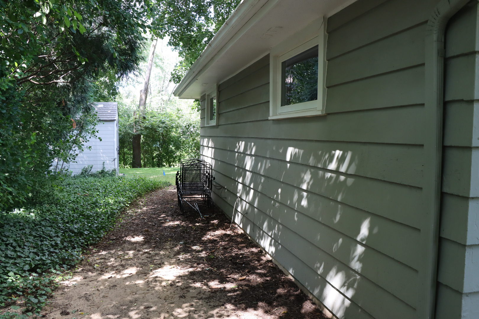 1920 North Washington Street Wheaton, IL 60187 - Photo 58 of 76 a backyard of a house with lots of green space