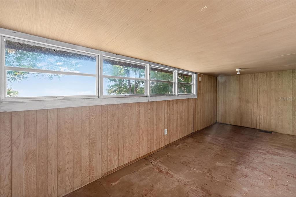54544 Buckhorn Road Astor, FL 32102 - Photo 13 of 36 an empty room with a window