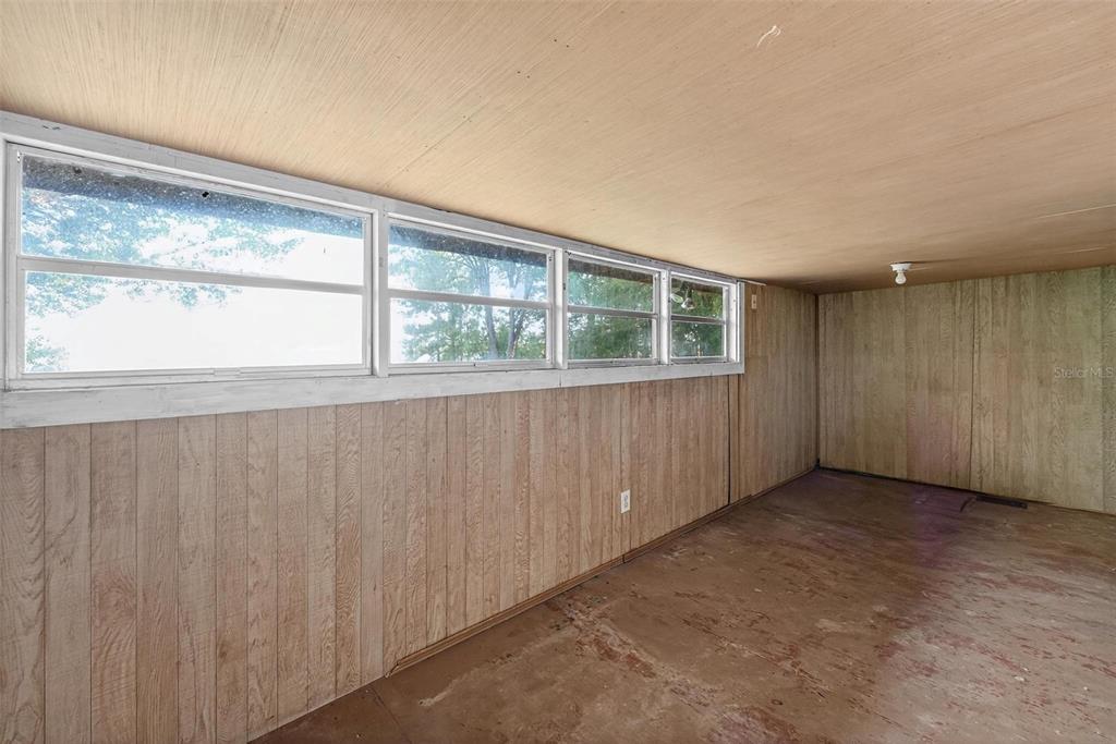 54544 Buckhorn Road Astor, FL 32102 - Photo 14 of 36 an empty room with a window