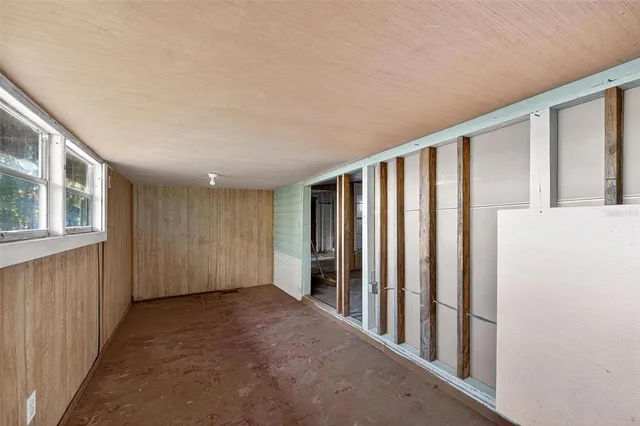 a view of an empty room with windows