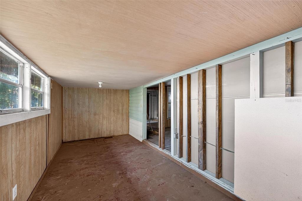 54544 Buckhorn Road Astor, FL 32102 - Photo 15 of 36 a view of an empty room with windows