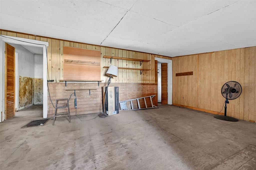 54544 Buckhorn Road Astor, FL 32102 - Photo 16 of 36 a view of empty room with wooden walls