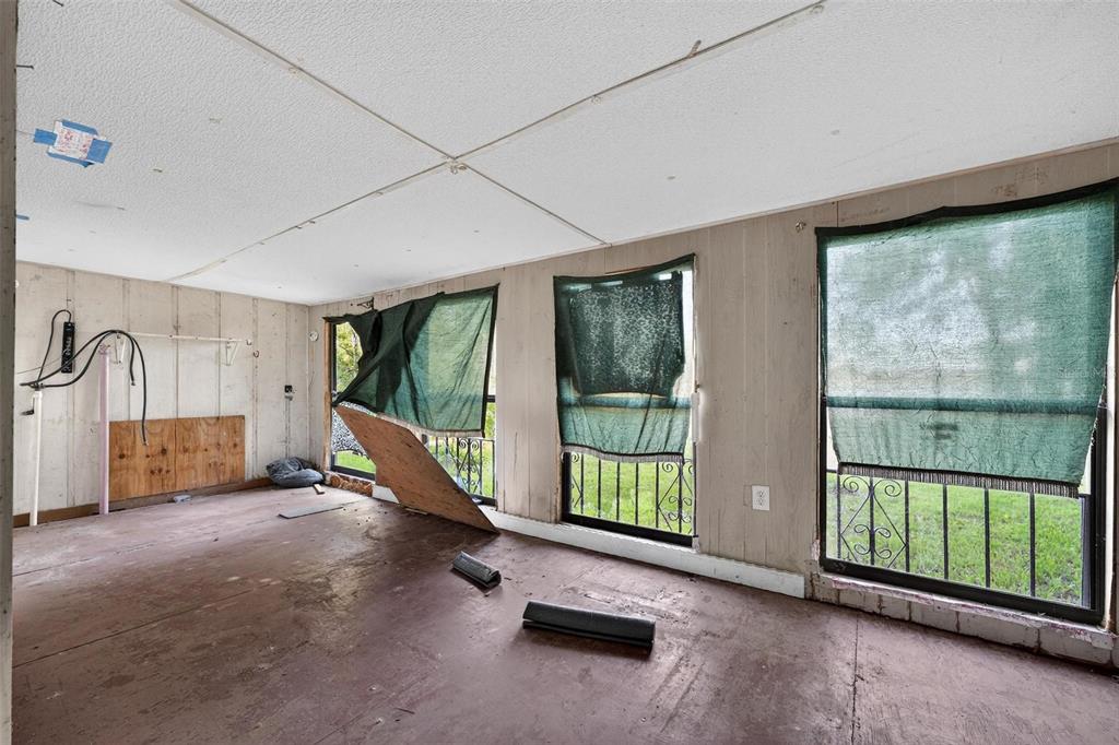 54544 Buckhorn Road Astor, FL 32102 - Photo 18 of 36 a view of a room with gym equipment