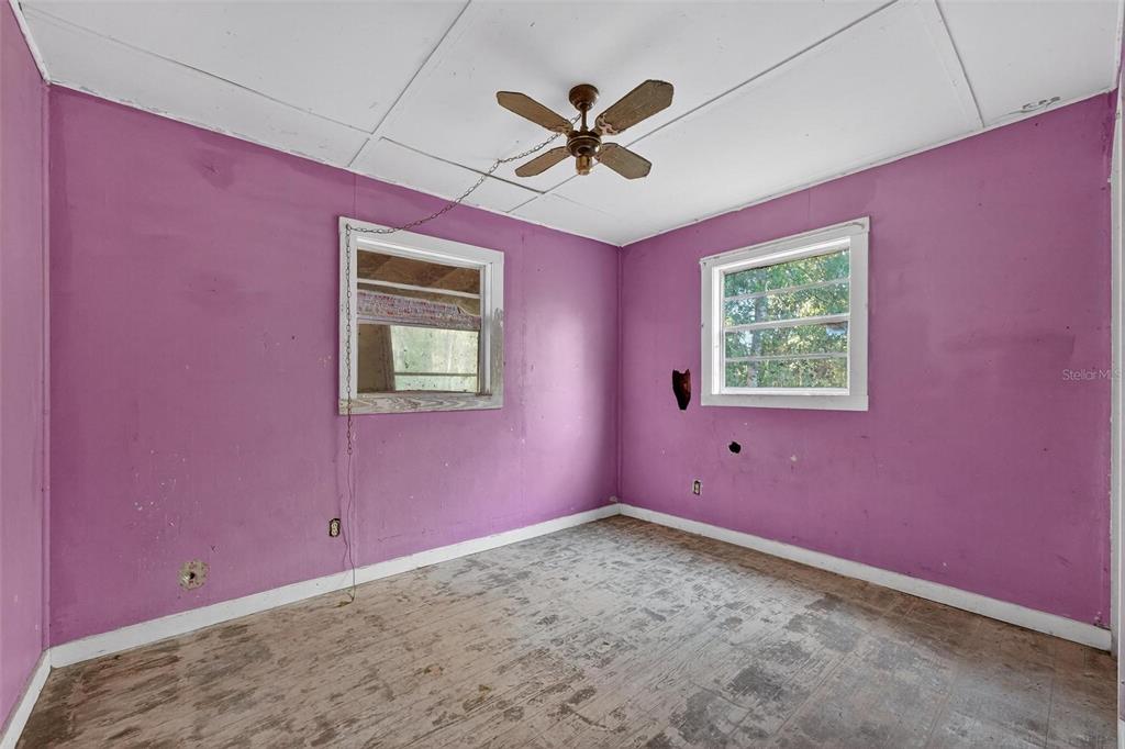 54544 Buckhorn Road Astor, FL 32102 - Photo 22 of 36 an empty room with a window