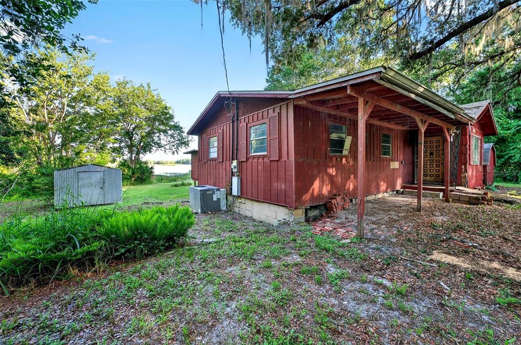 54544 Buckhorn Road Astor, FL 32102 - Photo 35 of 36 front view of a house with a yard