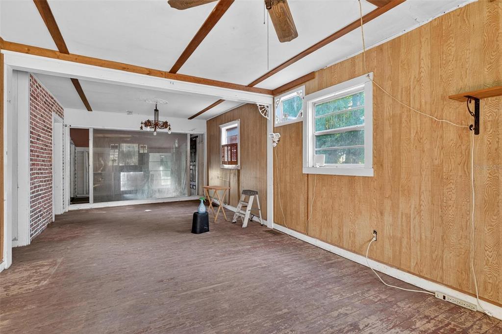 54544 Buckhorn Road Astor, FL 32102 - Photo 6 of 36 a view of a room with wooden floor and windows
