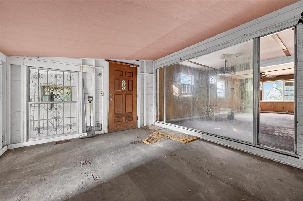 54544 Buckhorn Road Astor, FL 32102 - Photo 9 of 36 a view of an empty room with large windows