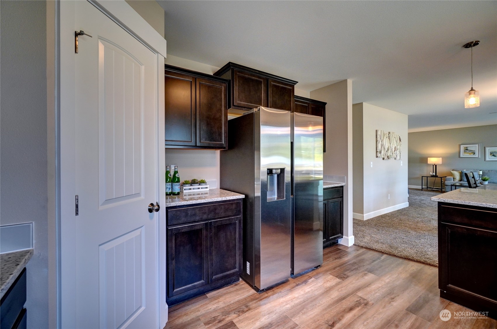 10705 36th Street East Edgewood, WA 98372 - Photo 15 of 40 a kitchen with stainless steel appliances granite countertop a refrigerator and a stove