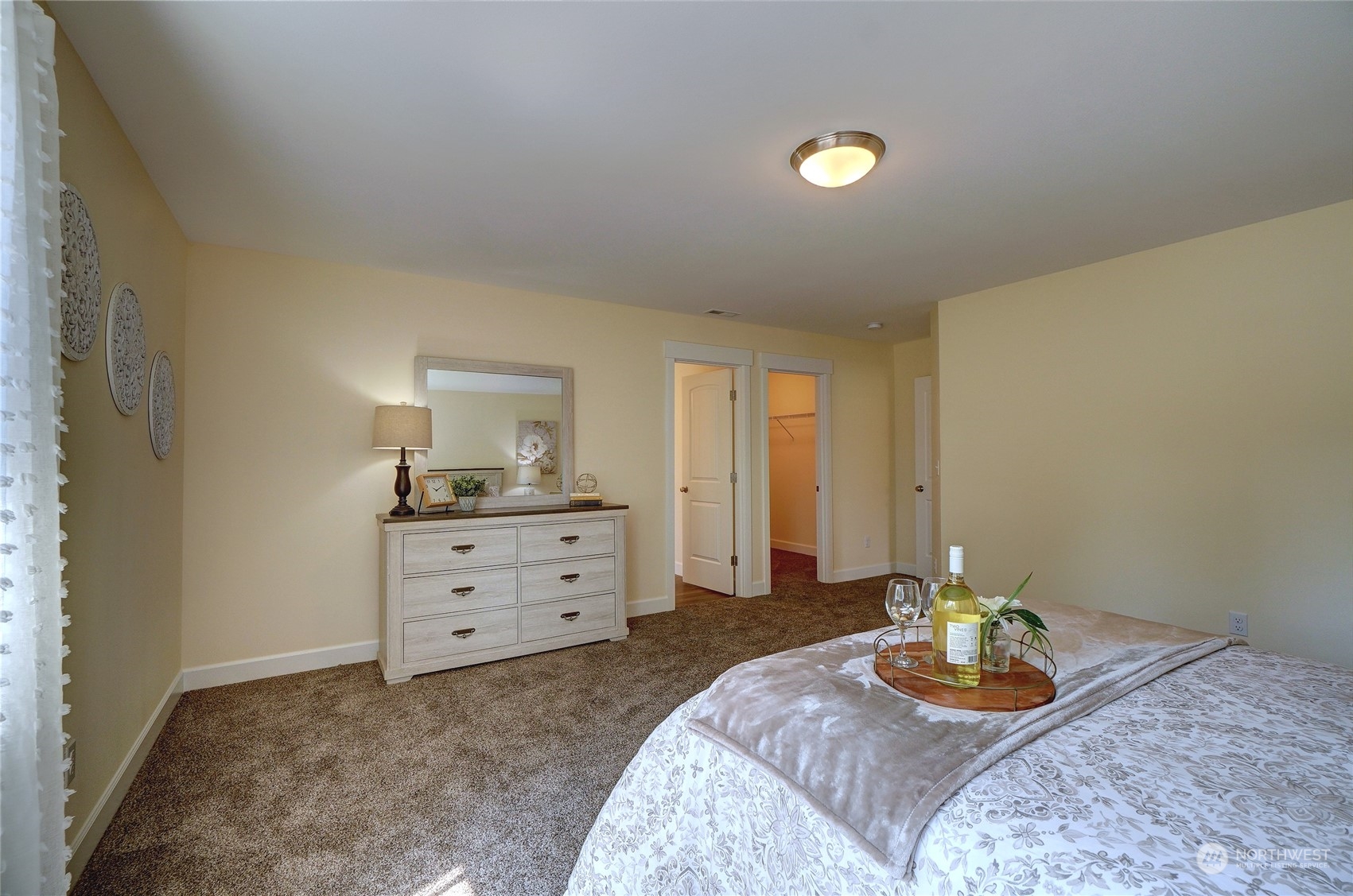 10705 36th Street East Edgewood, WA 98372 - Photo 18 of 40 a bedroom with a bed and a dresser