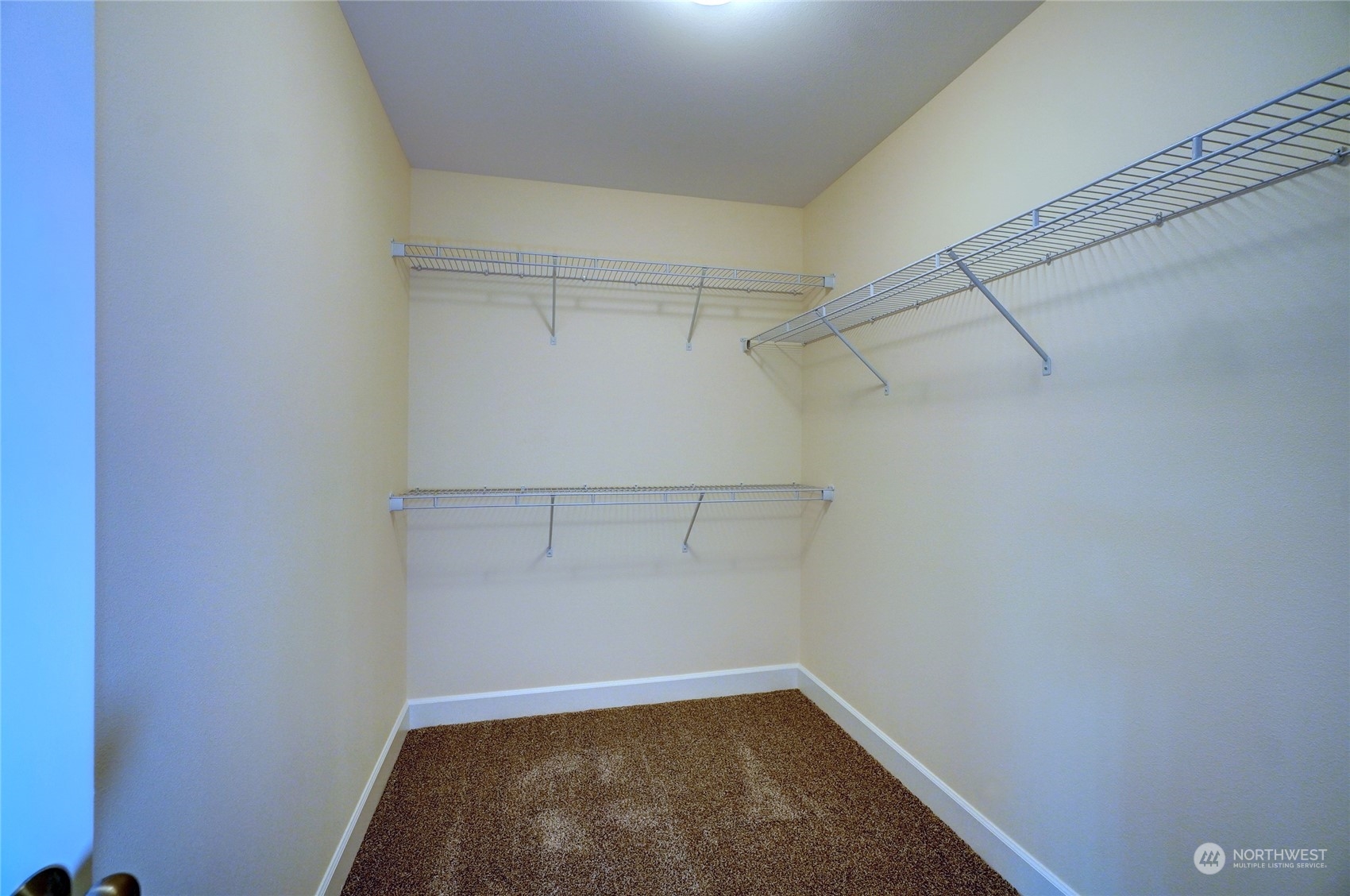 10705 36th Street East Edgewood, WA 98372 - Photo 22 of 40 a view of a room with racks on the wall