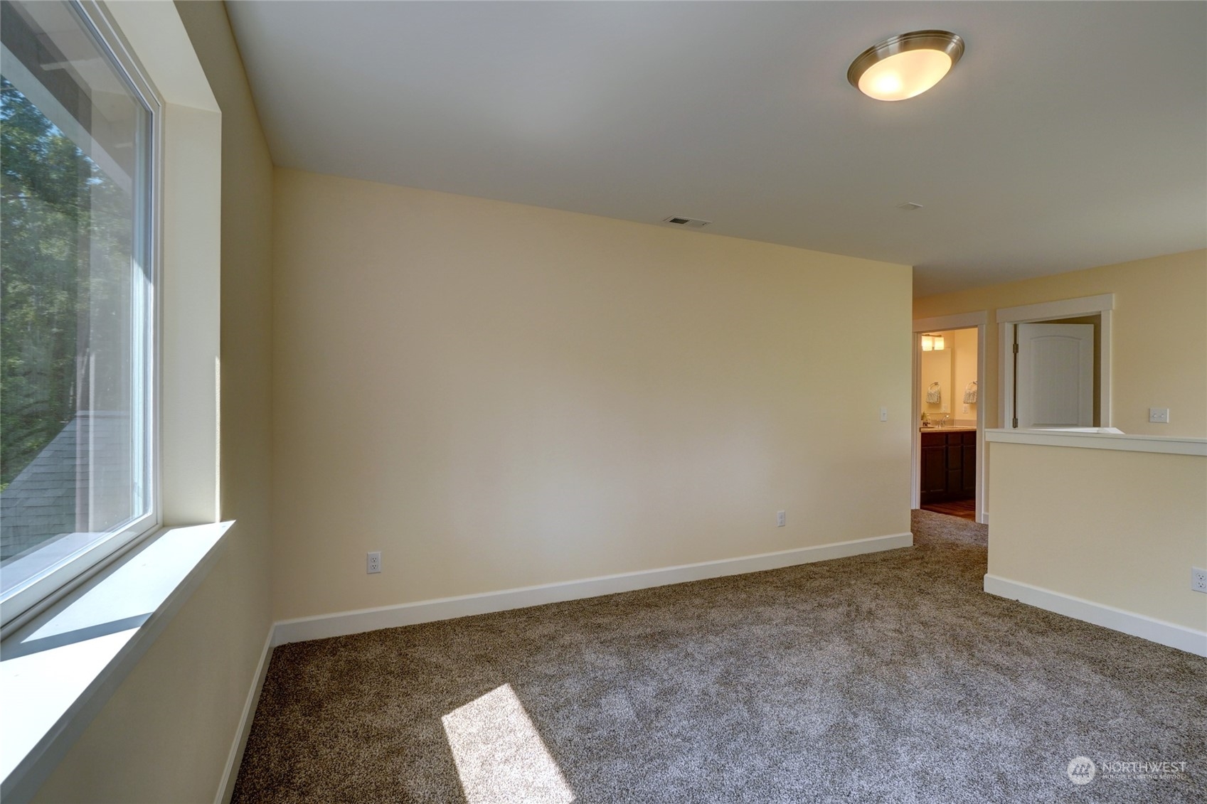 10705 36th Street East Edgewood, WA 98372 - Photo 24 of 40 a view of an empty room and window
