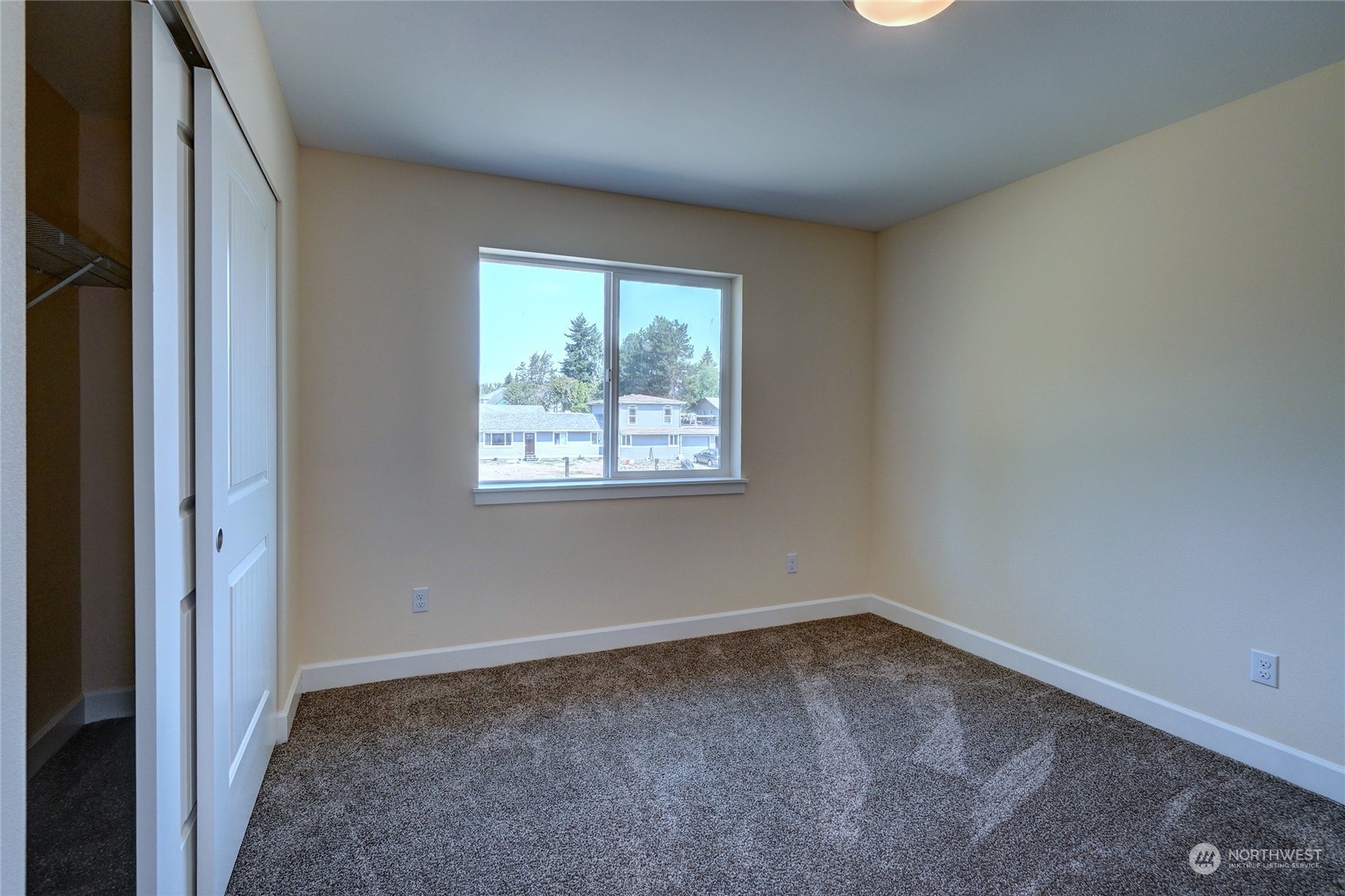 10705 36th Street East Edgewood, WA 98372 - Photo 27 of 40 an empty room with a window