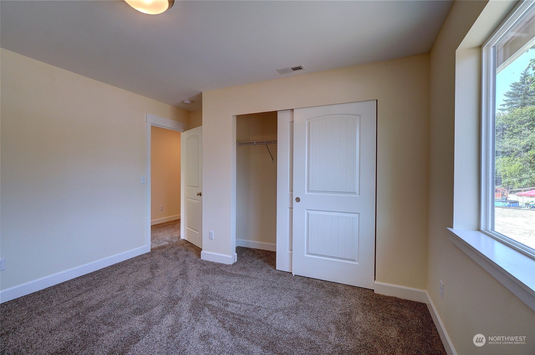 10705 36th Street East Edgewood, WA 98372 - Photo 28 of 40 an empty room with windows and closet