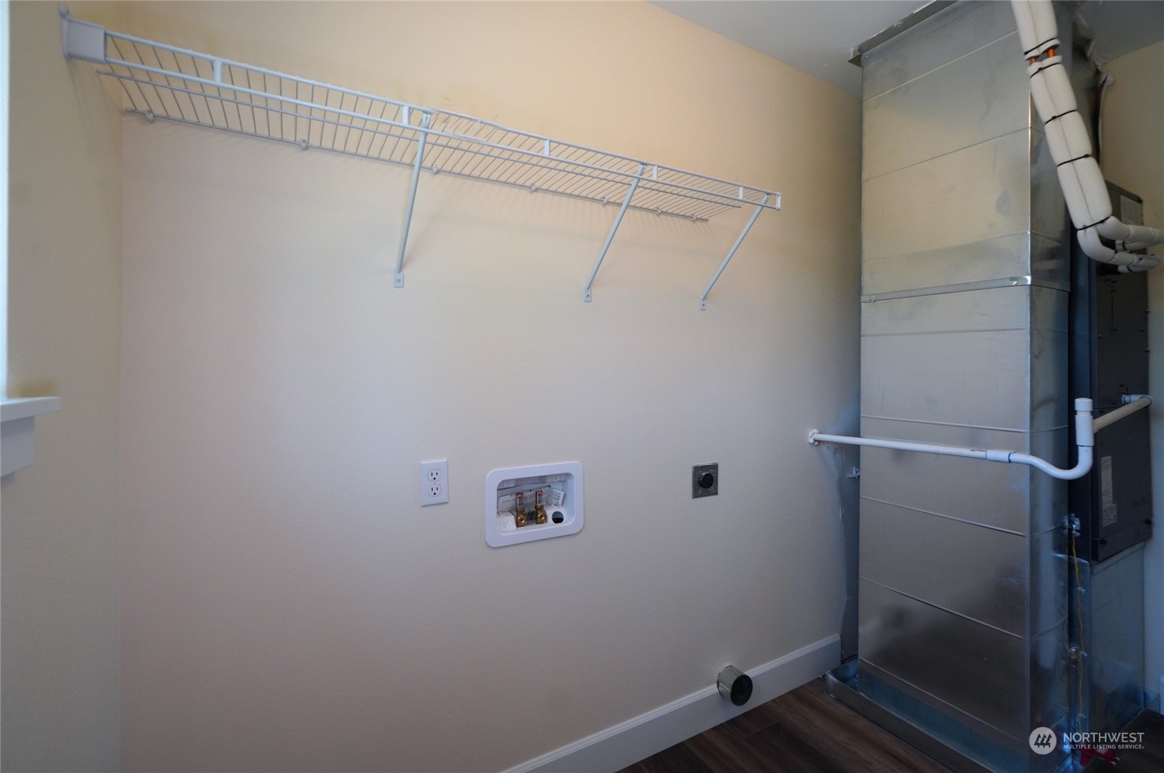 10705 36th Street East Edgewood, WA 98372 - Photo 30 of 40 a view of a room with racks on the wall