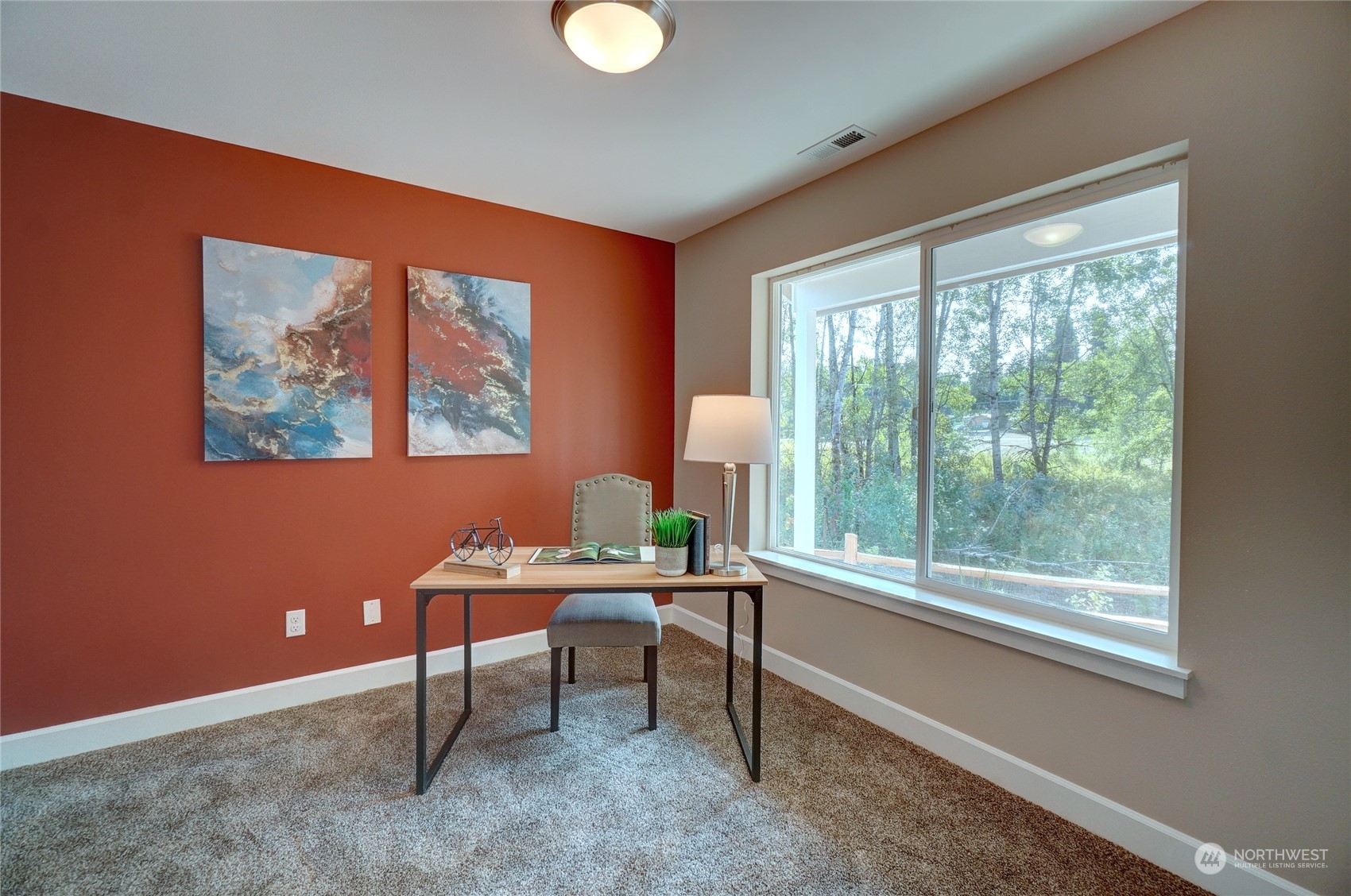 10705 36th Street East Edgewood, WA 98372 - Photo 3 of 40 a work room with furniture and a window