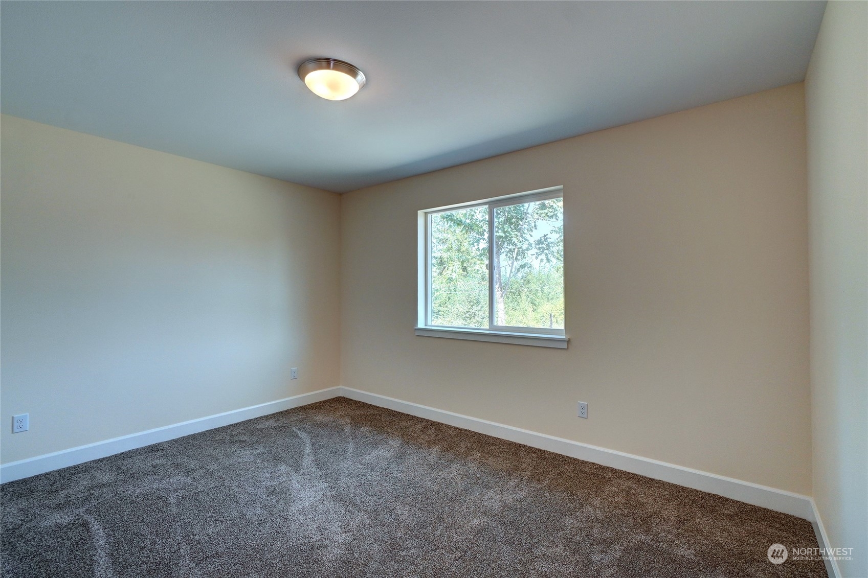 10705 36th Street East Edgewood, WA 98372 - Photo 31 of 40 an empty room with a window