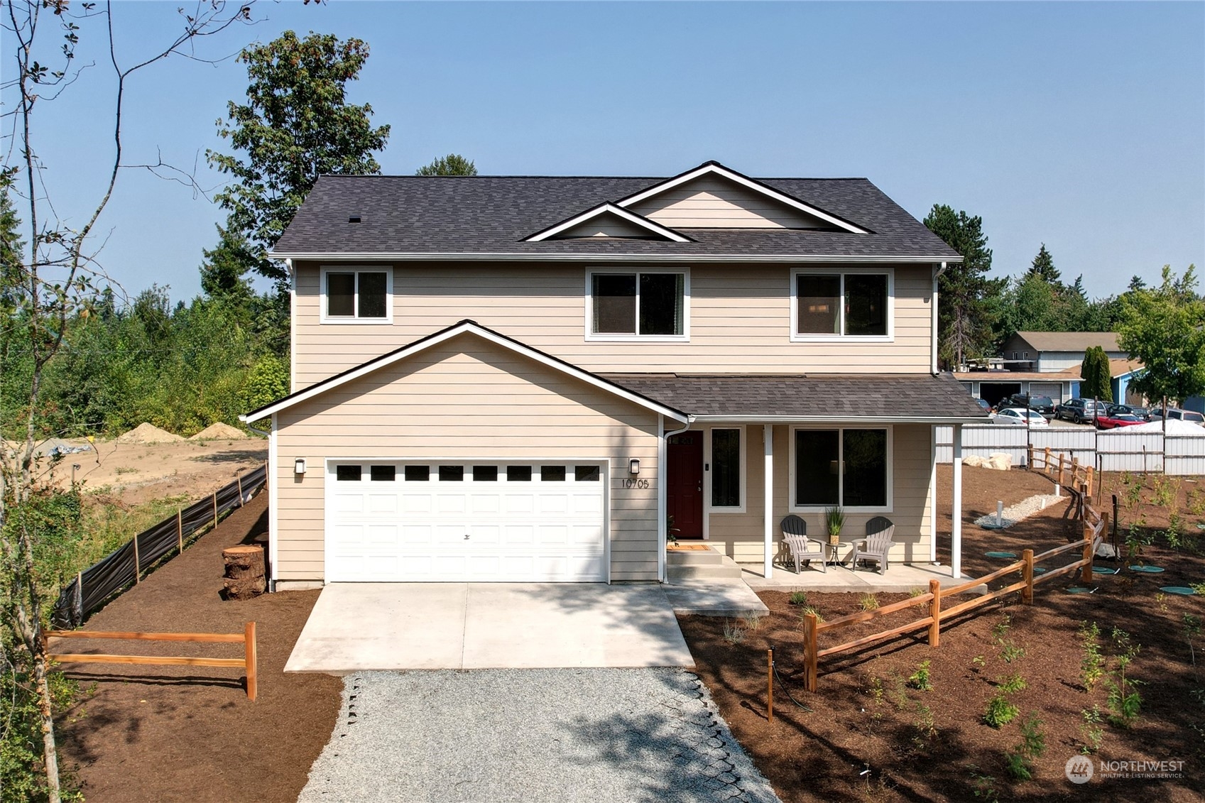 10705 36th Street East Edgewood, WA 98372 - Photo 34 of 40 a front view of a house with garden