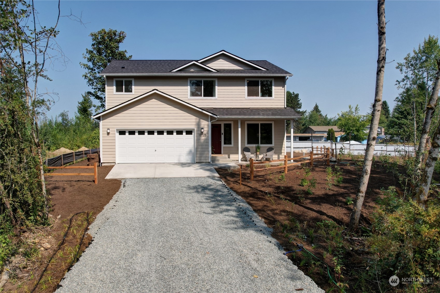 10705 36th Street East Edgewood, WA 98372 - Photo 38 of 40 a front view of a house with a yard