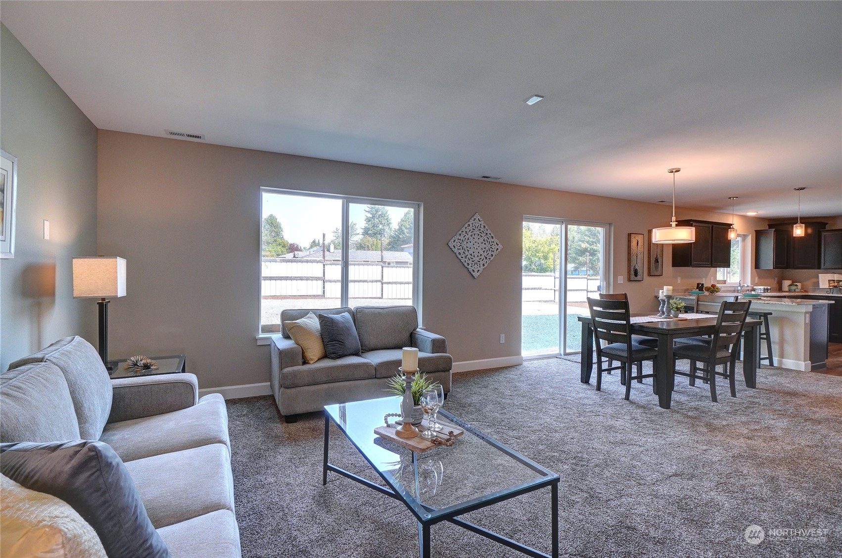 10705 36th Street East Edgewood, WA 98372 - Photo 8 of 40 a living room with furniture a dining table and a window