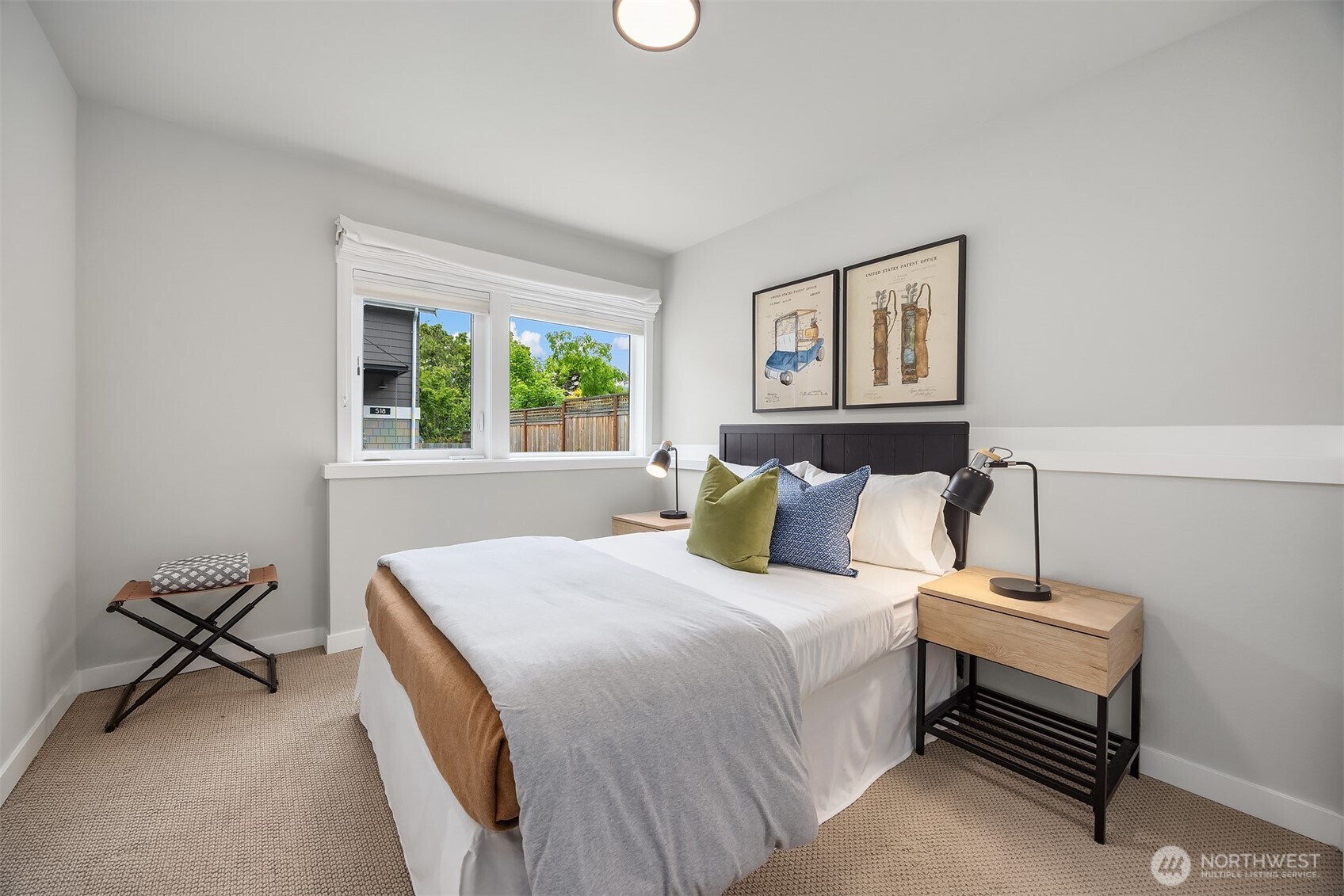 516 North 61st Street, Unit B Seattle, WA 98103 - Photo 13 of 17 a bedroom with a bed and a window