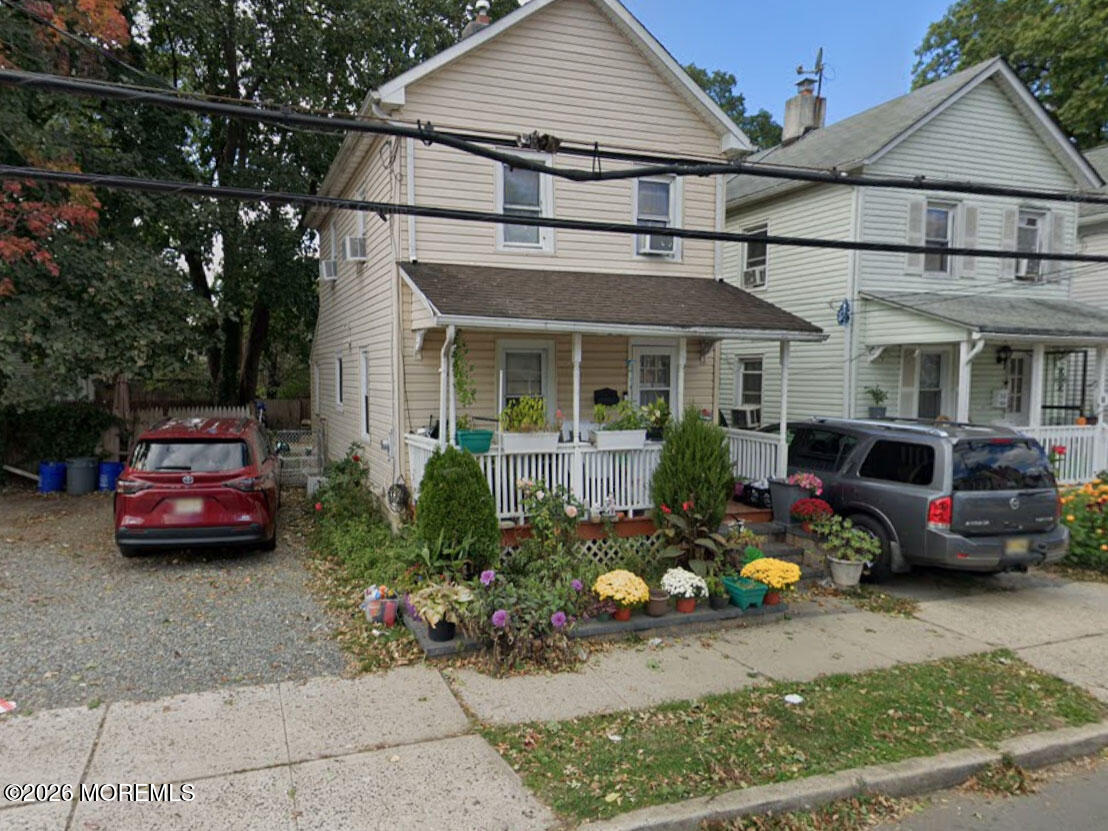 a view of a car park in front of house