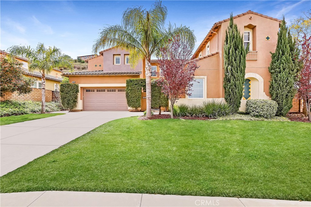16849 Ridge Cliff Drive Riverside, CA 92503 - Photo 1 of 1 a front view of a house with garden