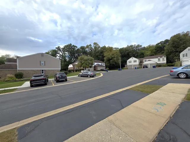 a view of street with parked cars