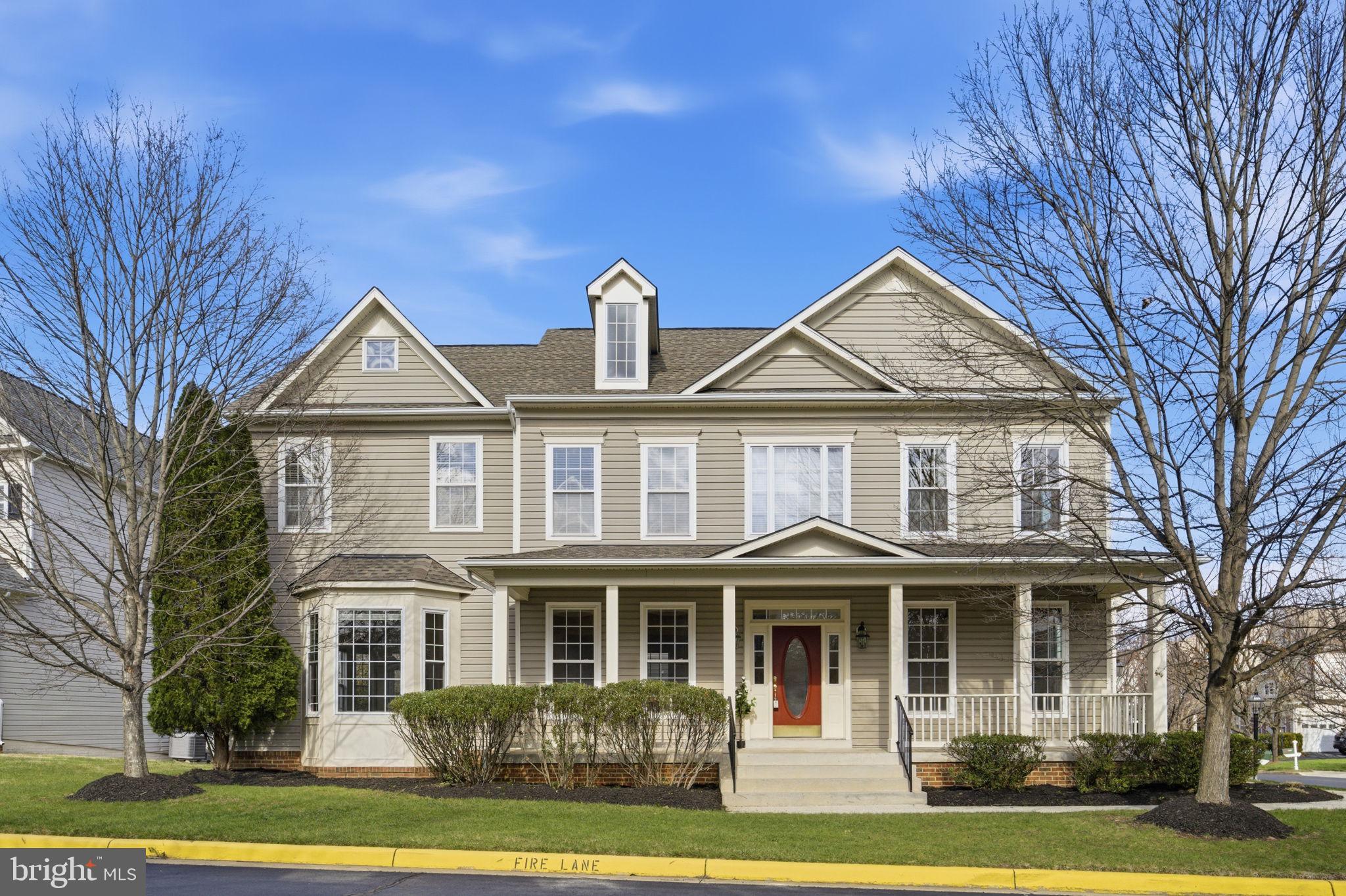 43358 Fullerton Street Ashburn, VA 20147 - Photo 1 of 54 a front view of a house with garden