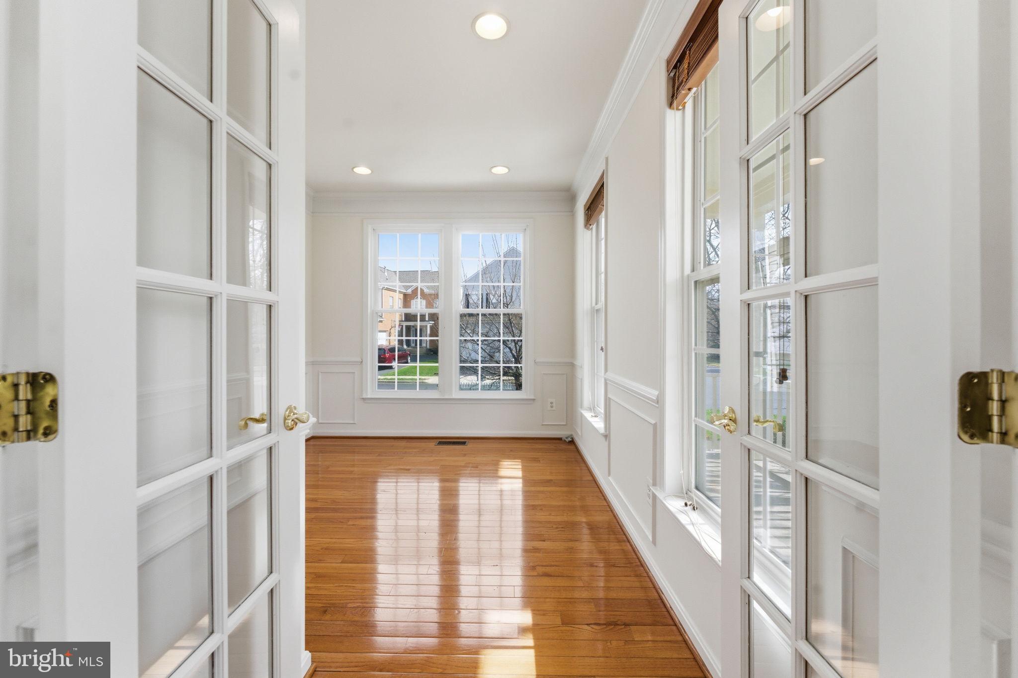 43358 Fullerton Street Ashburn, VA 20147 - Photo 20 of 54 a view of a hallway with windows