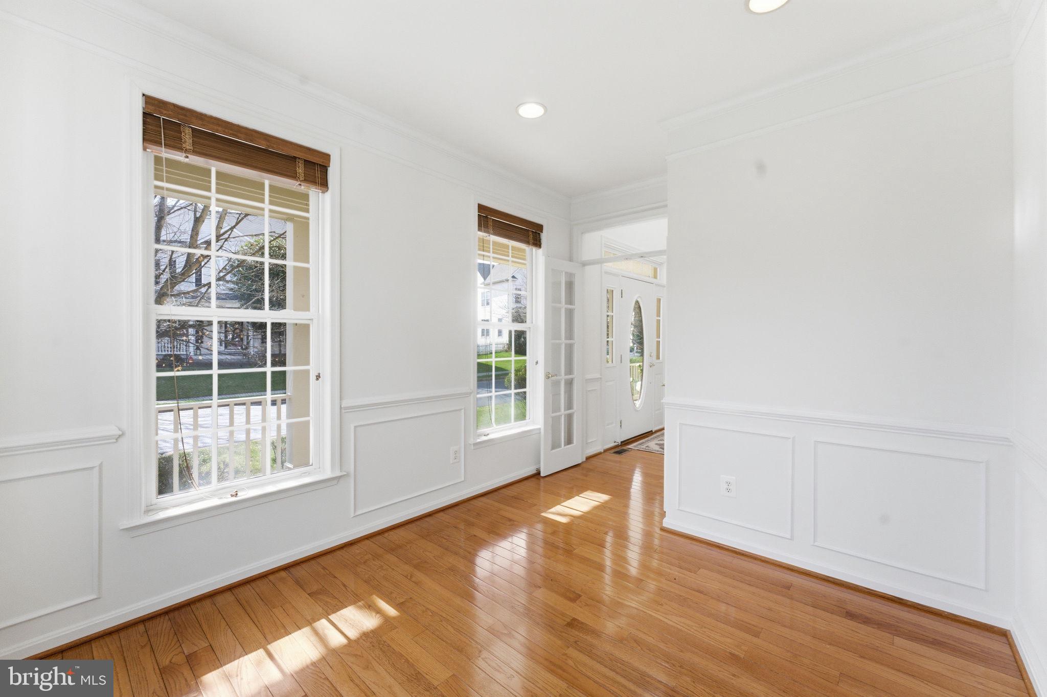 43358 Fullerton Street Ashburn, VA 20147 - Photo 23 of 54 a view of an empty room with wooden floor and a window