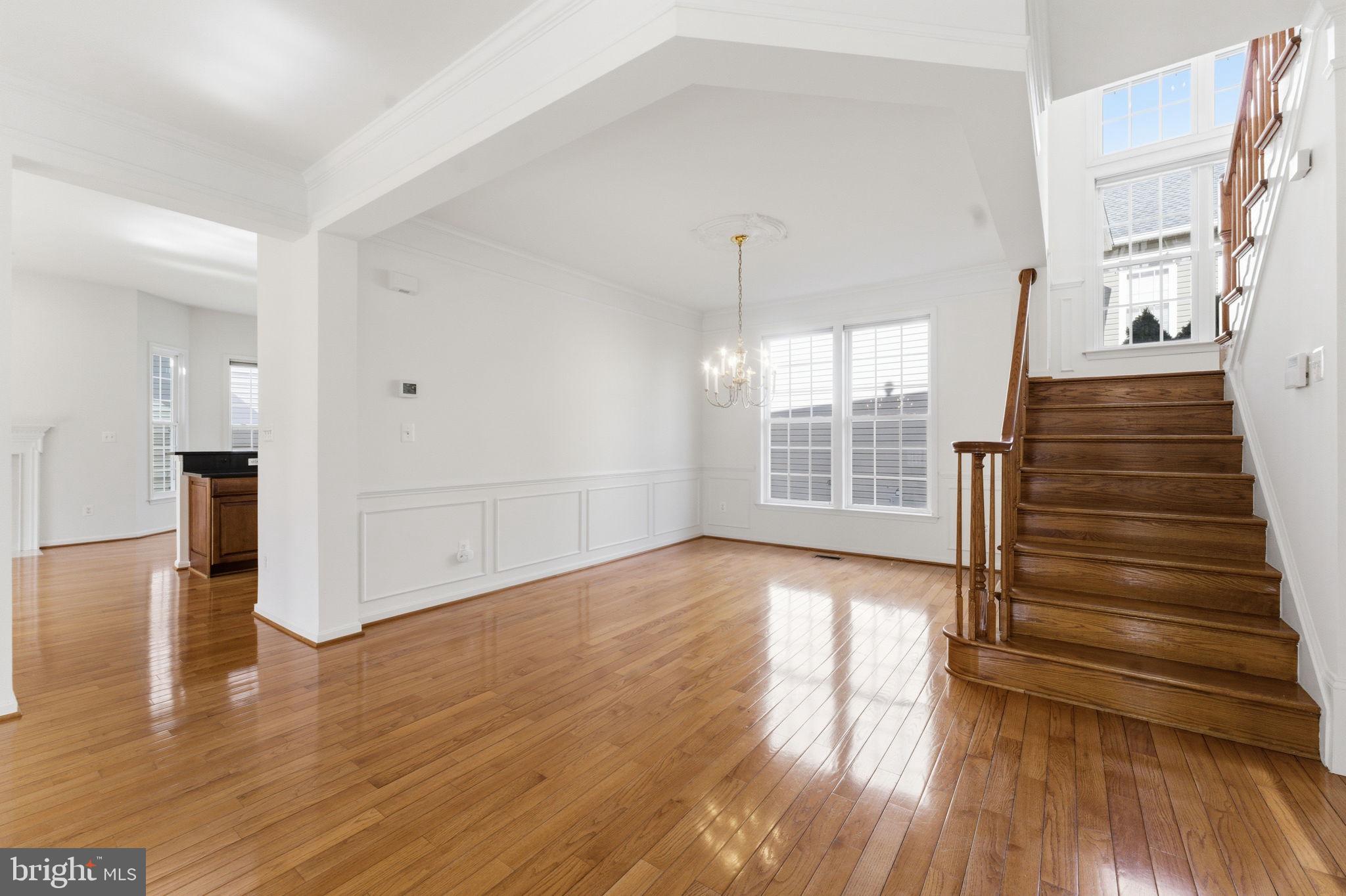 43358 Fullerton Street Ashburn, VA 20147 - Photo 25 of 54 a view of an empty room with wooden floor and a window