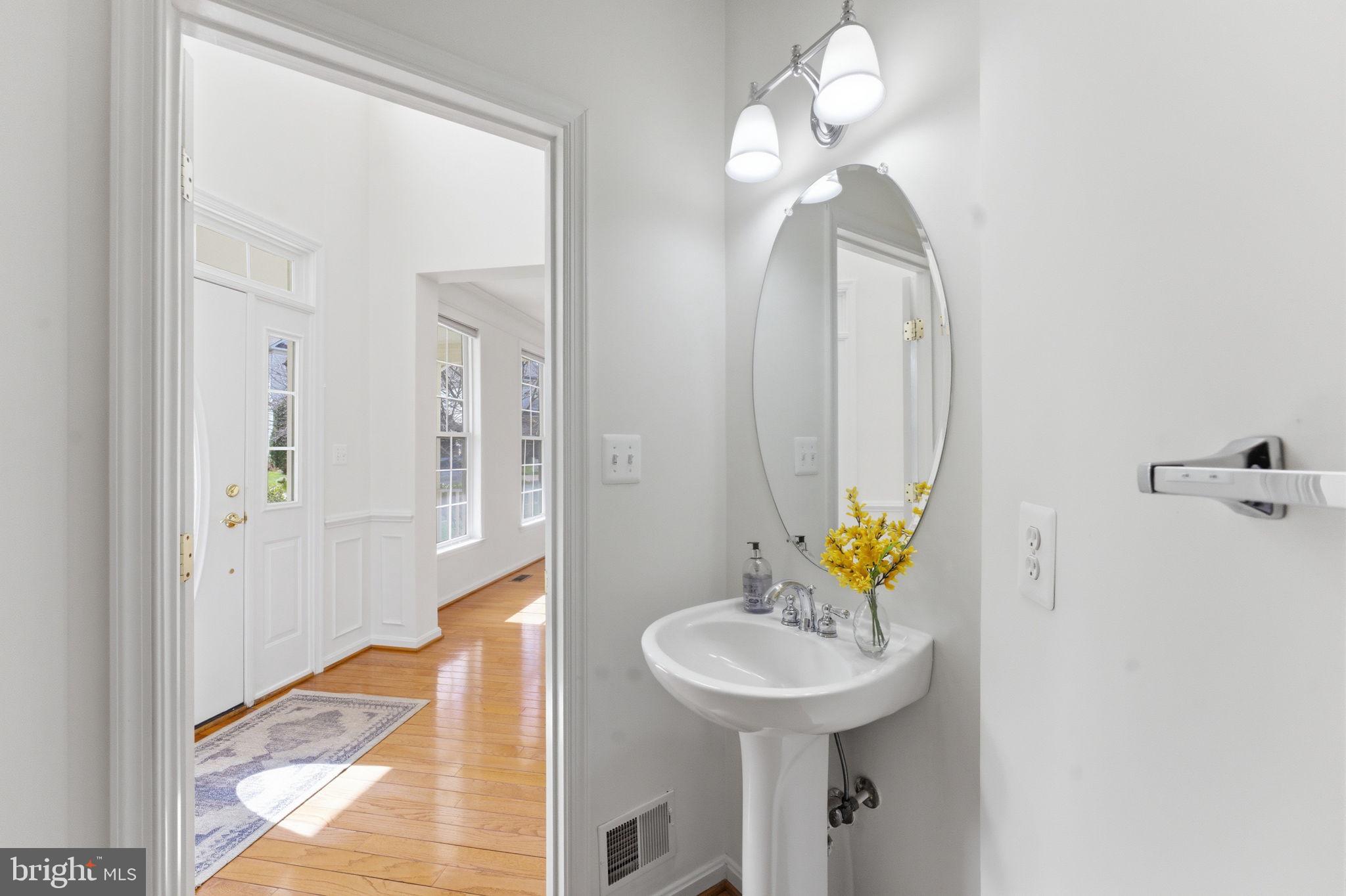 43358 Fullerton Street Ashburn, VA 20147 - Photo 26 of 54 a view of a hallway with mirror