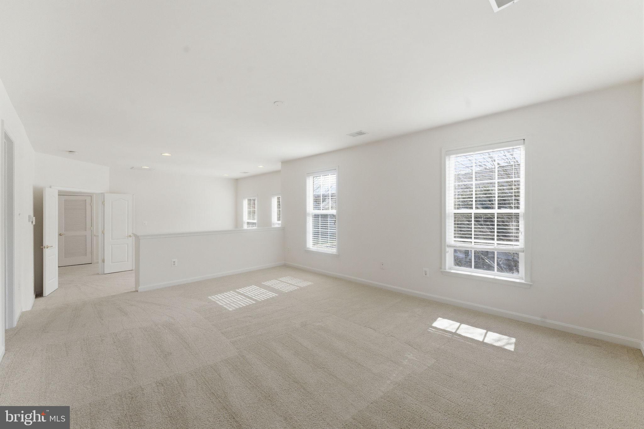 43358 Fullerton Street Ashburn, VA 20147 - Photo 34 of 54 an empty room with windows