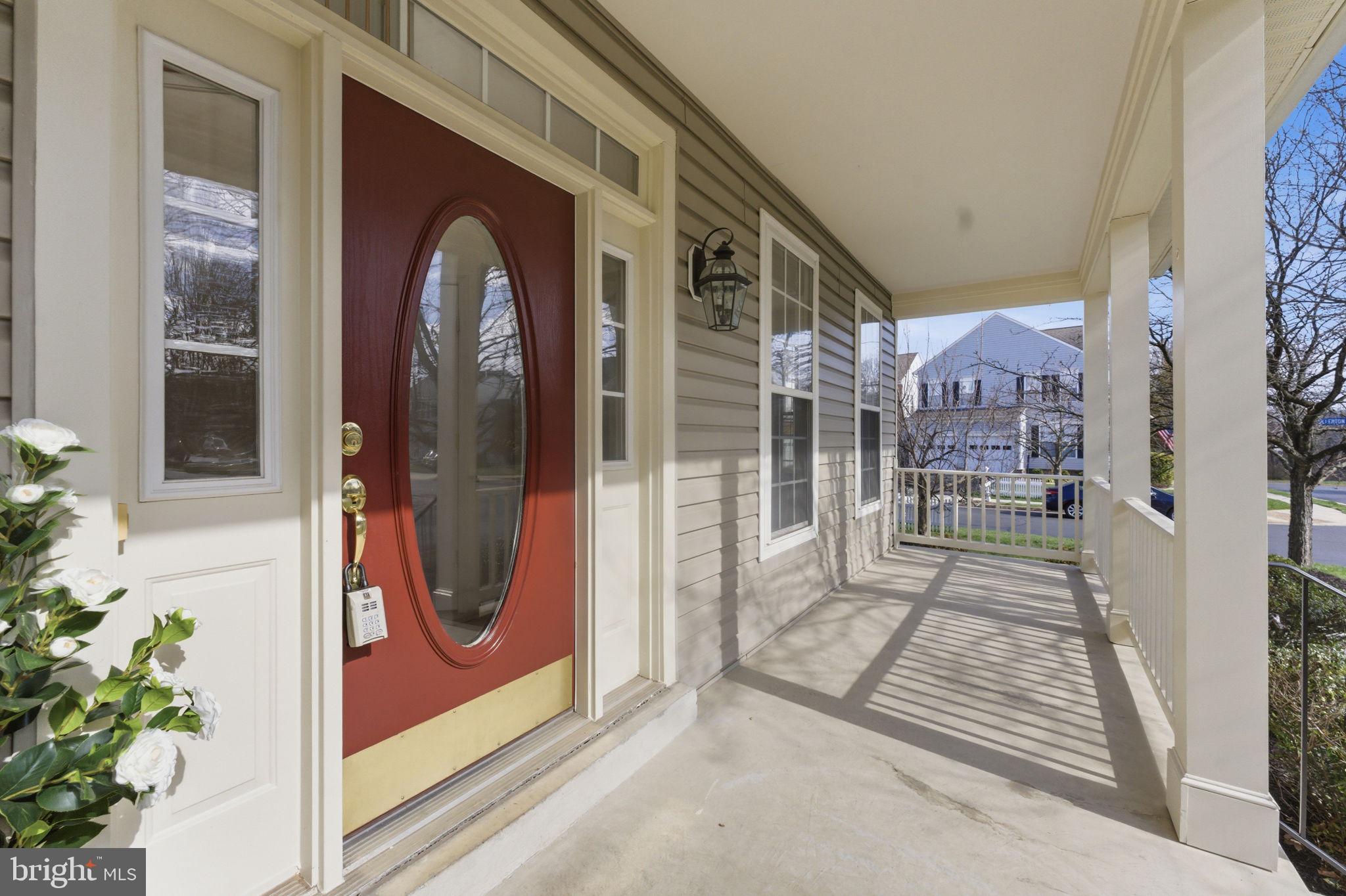 43358 Fullerton Street Ashburn, VA 20147 - Photo 5 of 54 a view of a brick house with a potted plant