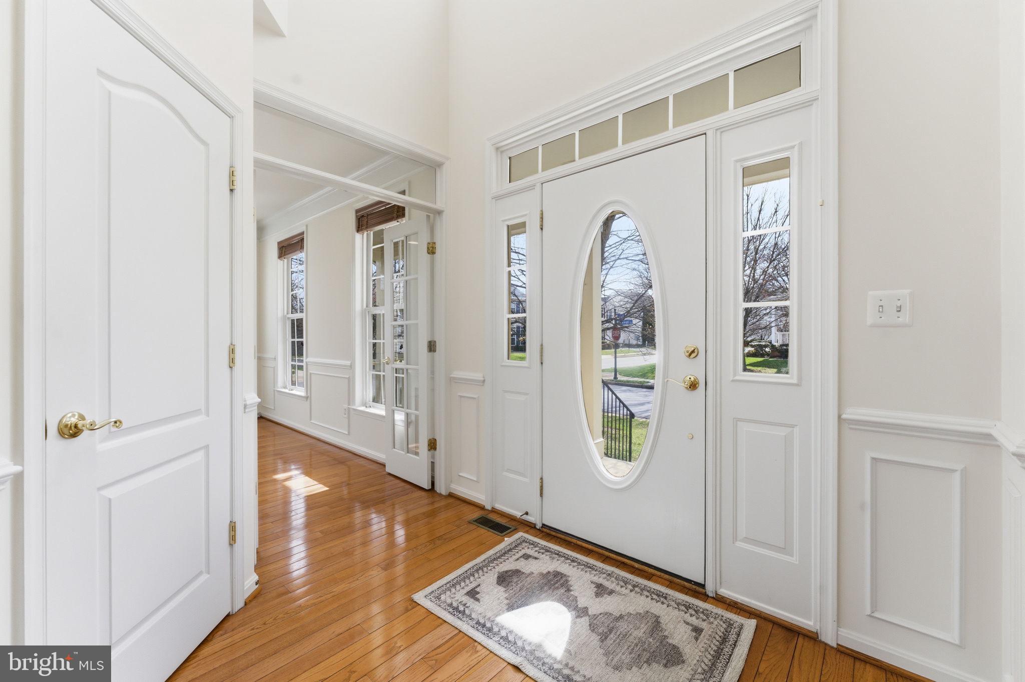 43358 Fullerton Street Ashburn, VA 20147 - Photo 6 of 54 a view of an entryway with wooden floor