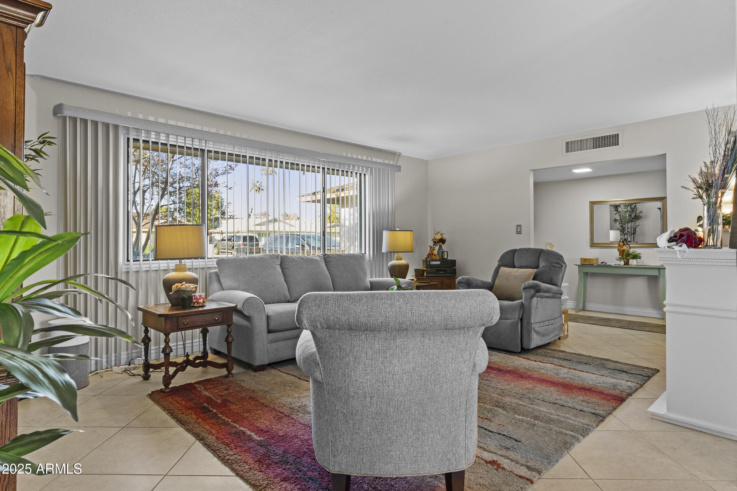 1019 East Watson Drive Tempe, AZ 85283 - Photo 10 of 46 a living room with furniture and a large window