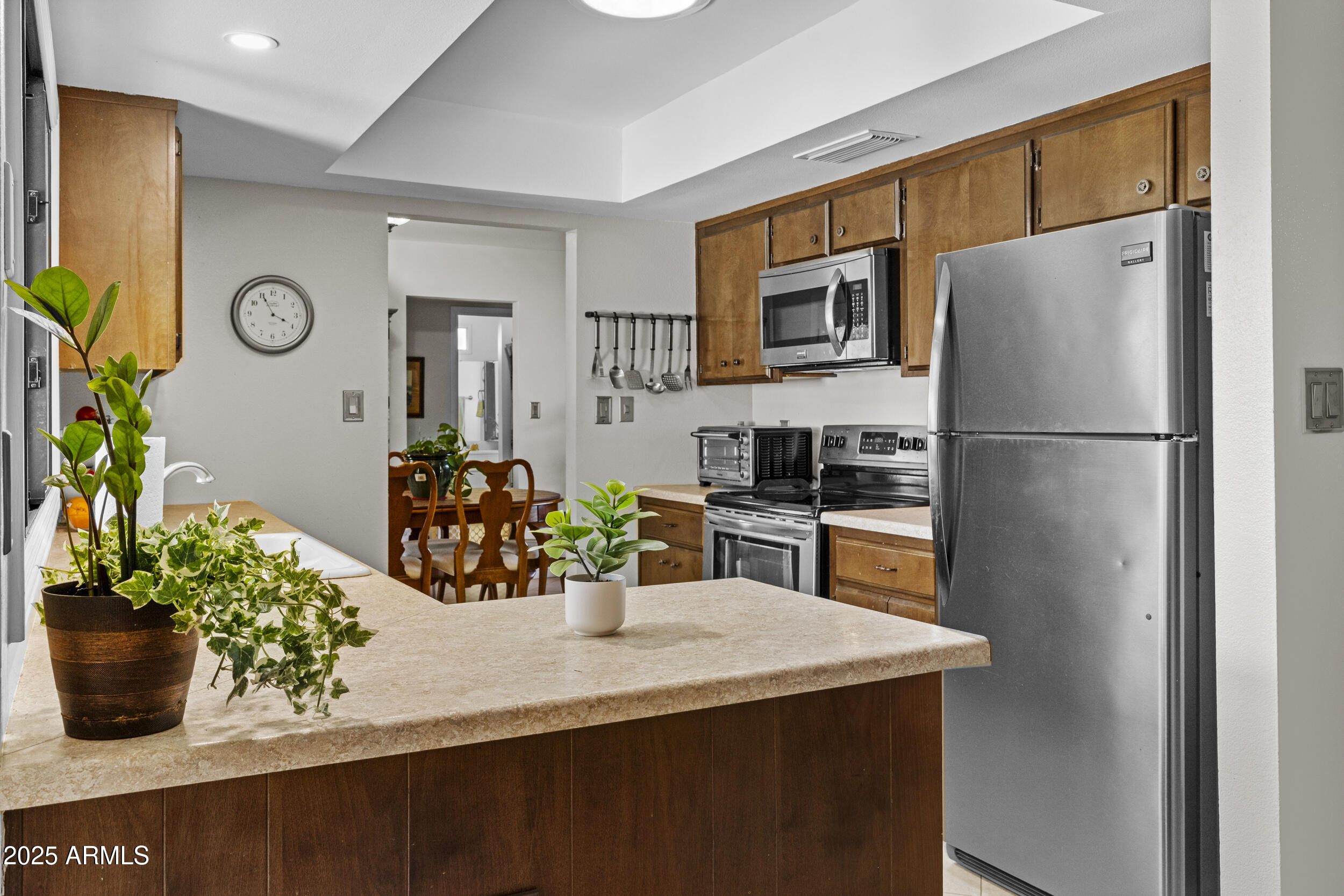 1019 East Watson Drive Tempe, AZ 85283 - Photo 11 of 46 a kitchen with a refrigerator and a sink