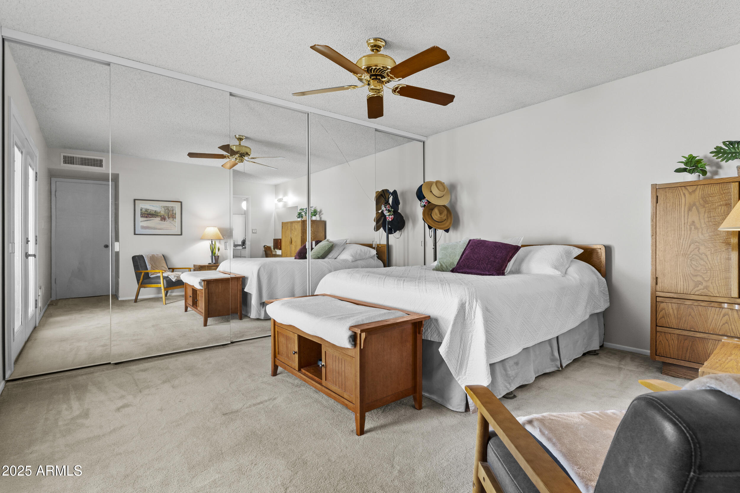 1019 East Watson Drive Tempe, AZ 85283 - Photo 16 of 46 a bedroom with a bed and ceiling fan
