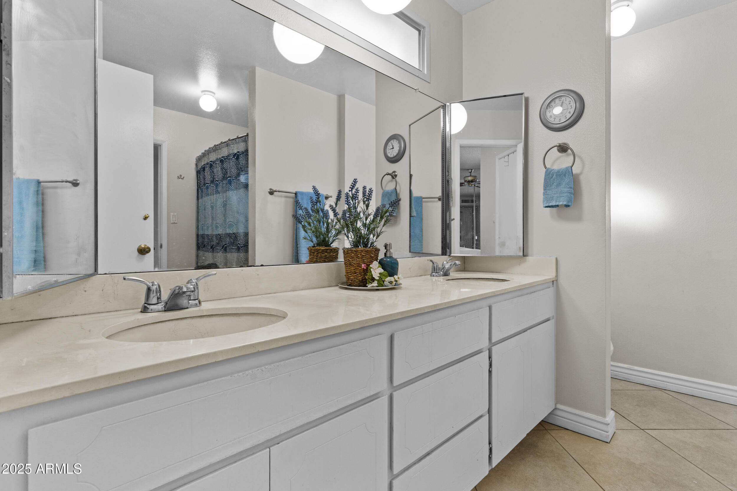 1019 East Watson Drive Tempe, AZ 85283 - Photo 20 of 46 a bathroom with a double vanity sink and a mirror