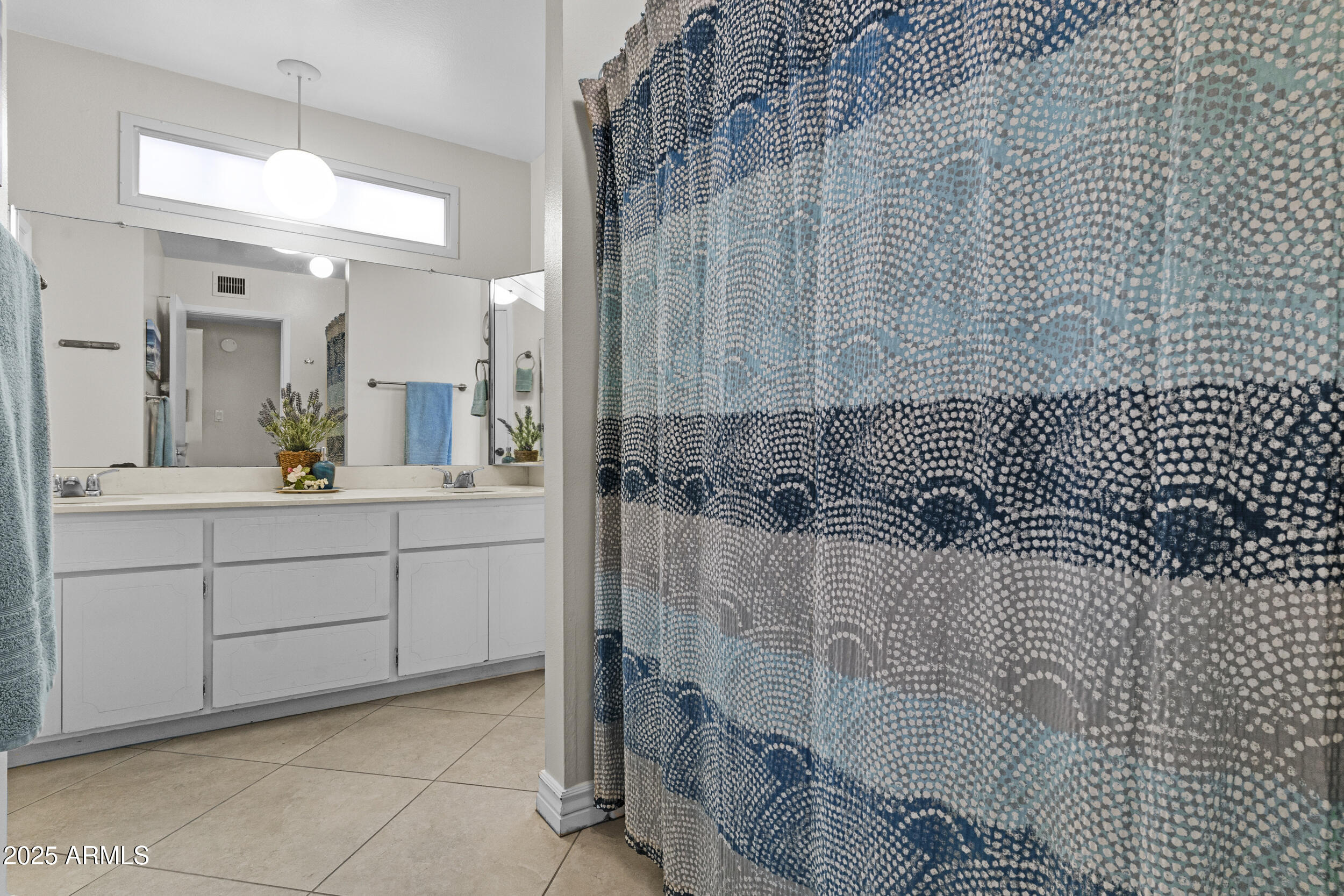 1019 East Watson Drive Tempe, AZ 85283 - Photo 21 of 46 a bathroom with a sink and mirror