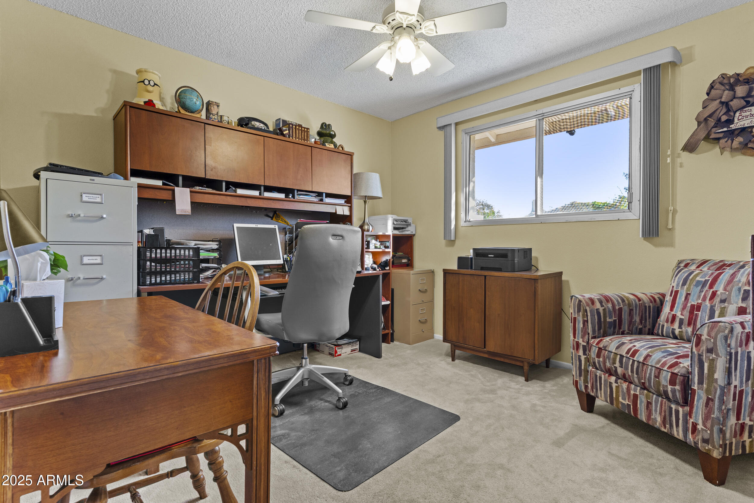 1019 East Watson Drive Tempe, AZ 85283 - Photo 22 of 46 a view of a workspace with furniture and a window