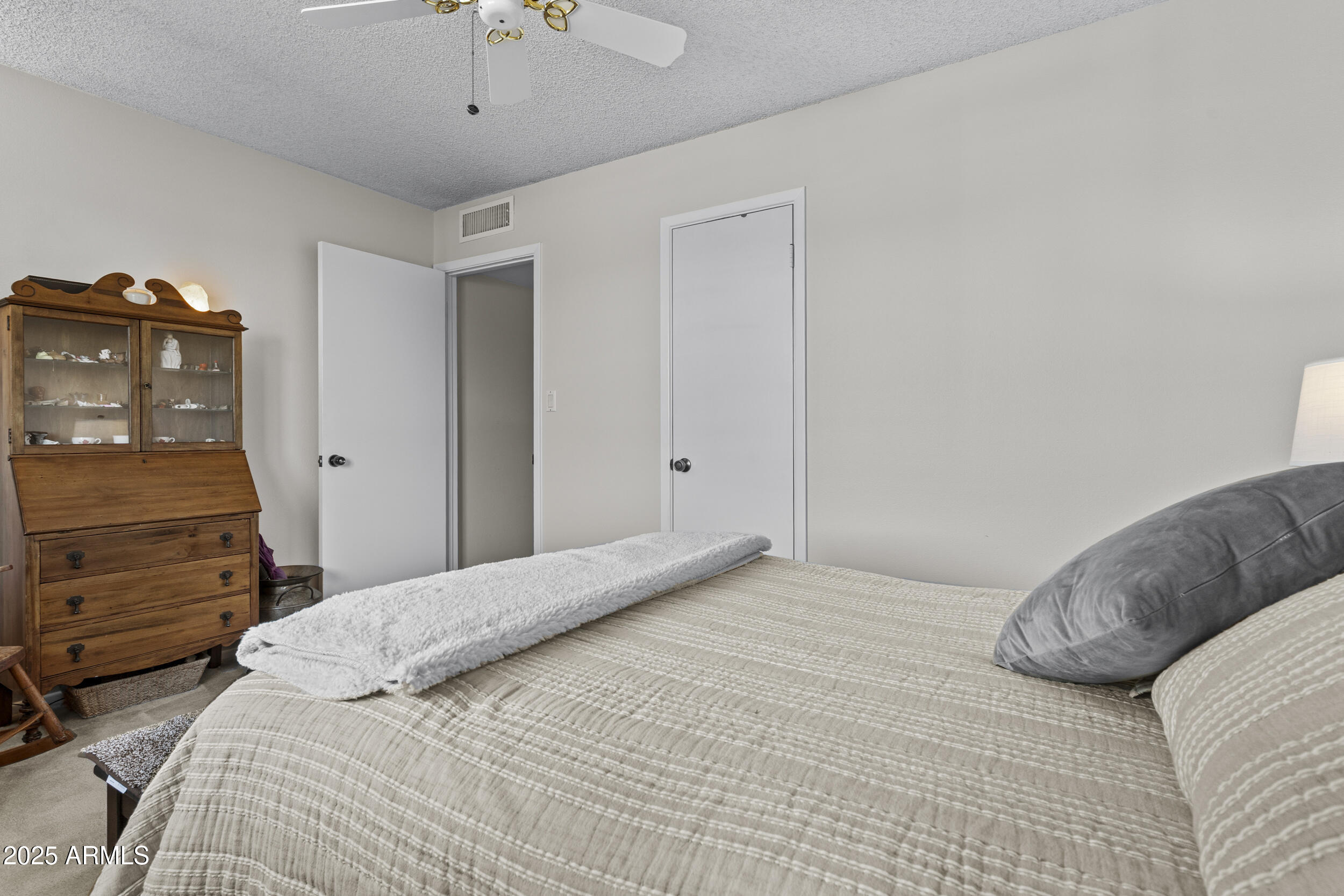 1019 East Watson Drive Tempe, AZ 85283 - Photo 25 of 46 a bedroom with a bed and dresser