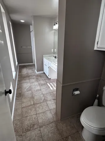 a view of a hallway with a chandelier