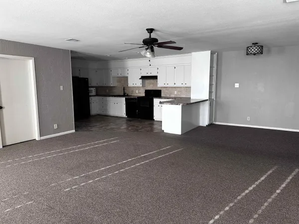 a bathroom with a toilet a sink and a mirror