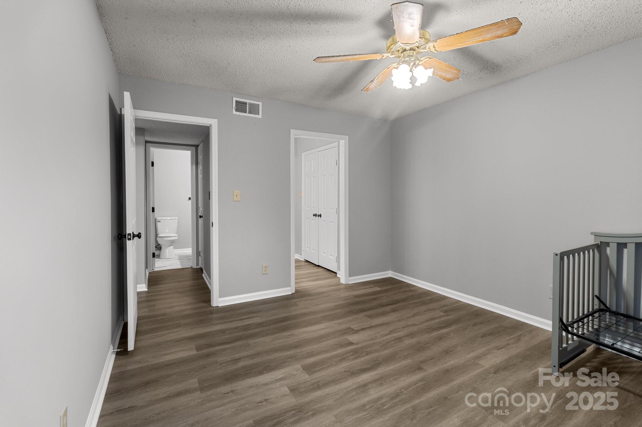 140 Lake Concord Road Northeast, Unit D9 Concord, NC 28025 - Photo 12 of 28 a view of an empty room with wooden floor