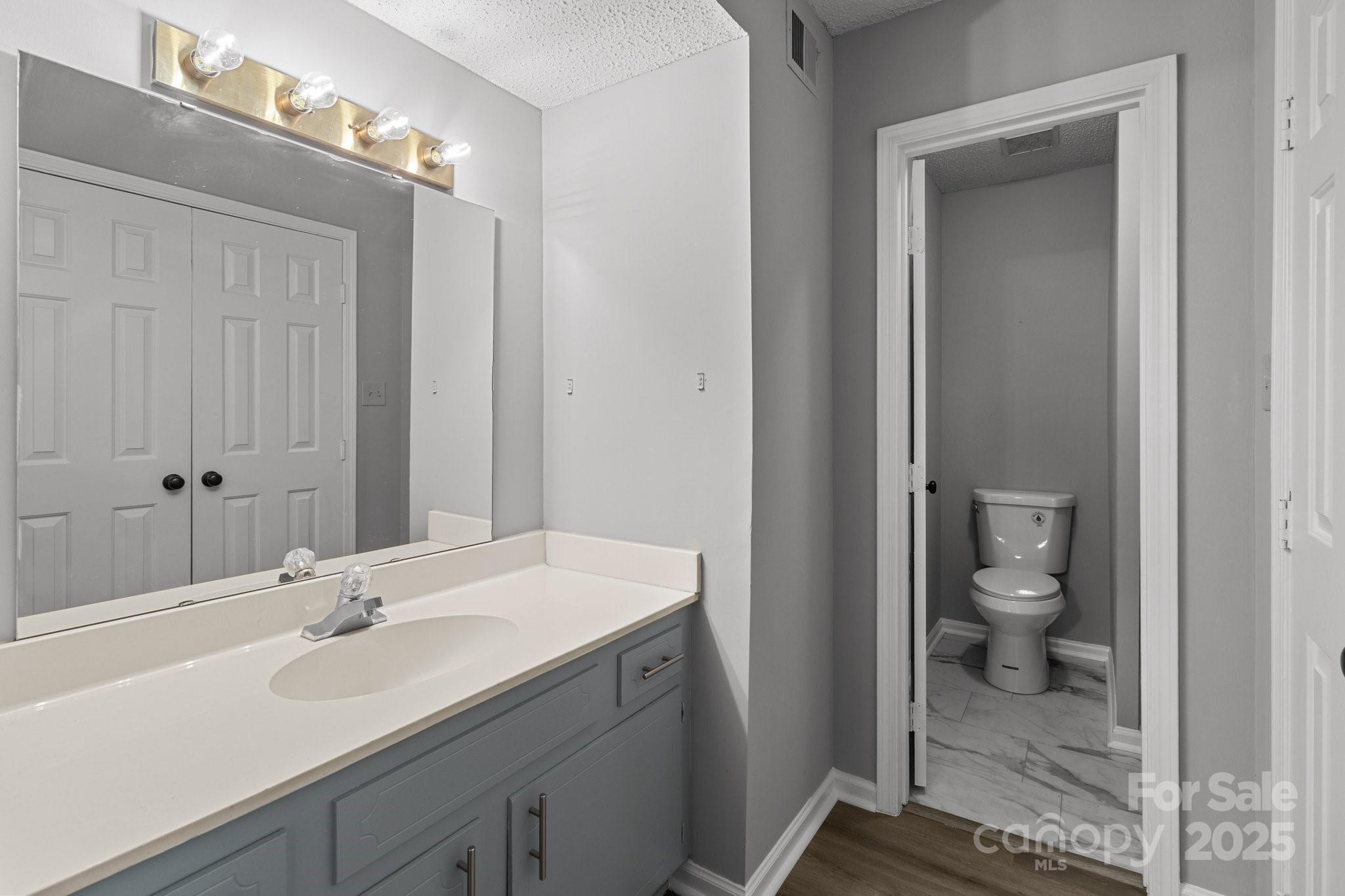 140 Lake Concord Road Northeast, Unit D9 Concord, NC 28025 - Photo 13 of 28 a bathroom with a sink a toilet and shower